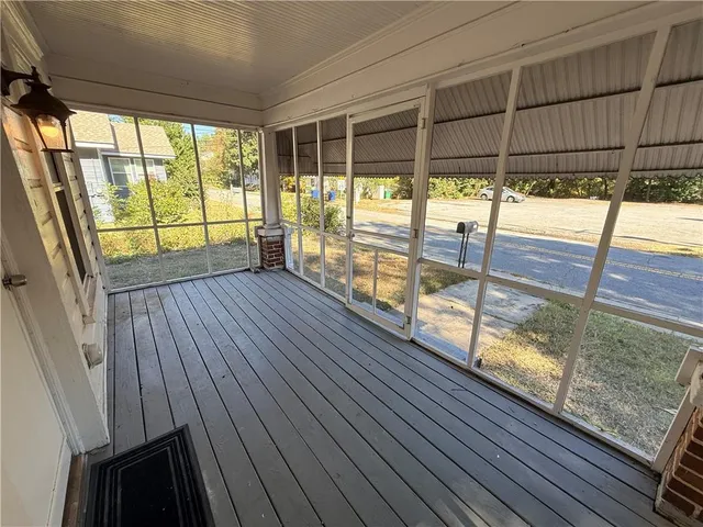 a view of porch with wooden floor