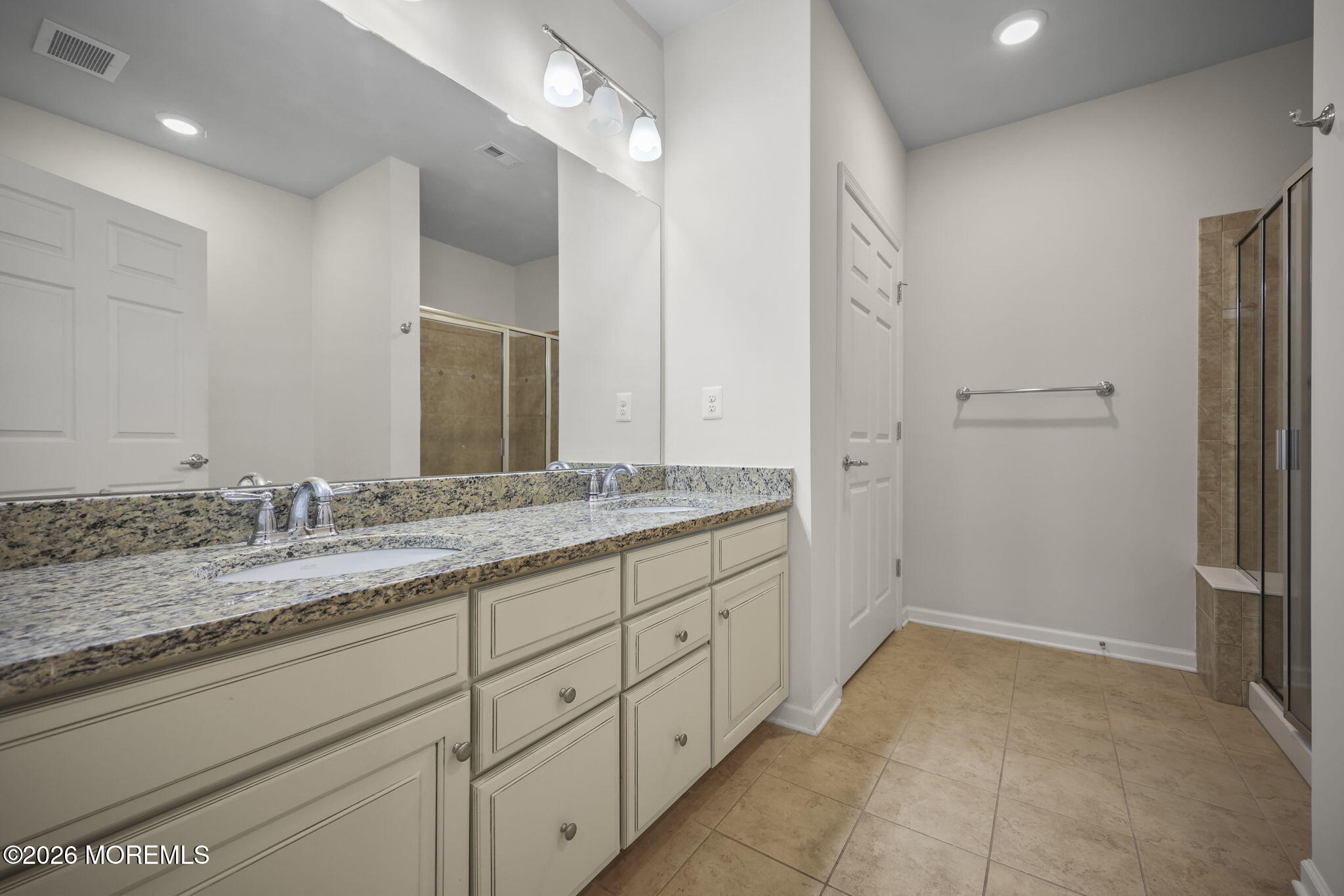 2201 River Road, Unit 4207 Point Pleasant, NJ 08742 - Photo 11 of 34 a bathroom with a granite countertop sink and a mirror