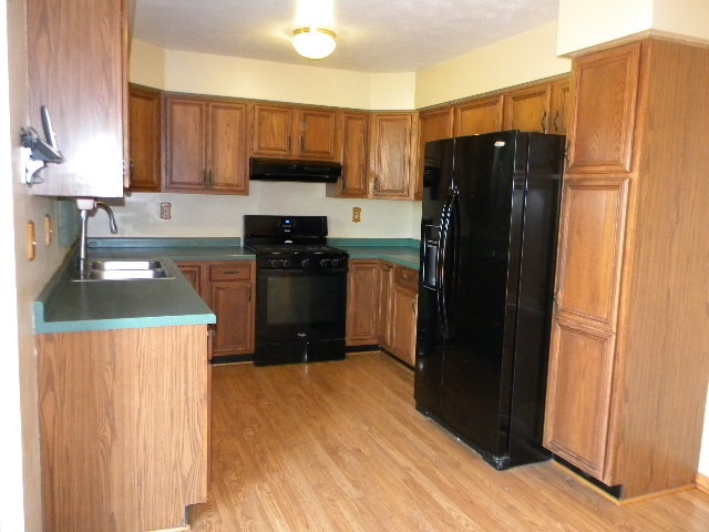 617 Pin Oak Road Rockton, IL 61072 - Photo 11 of 25 a kitchen with stainless steel appliances granite countertop a refrigerator stove and sink