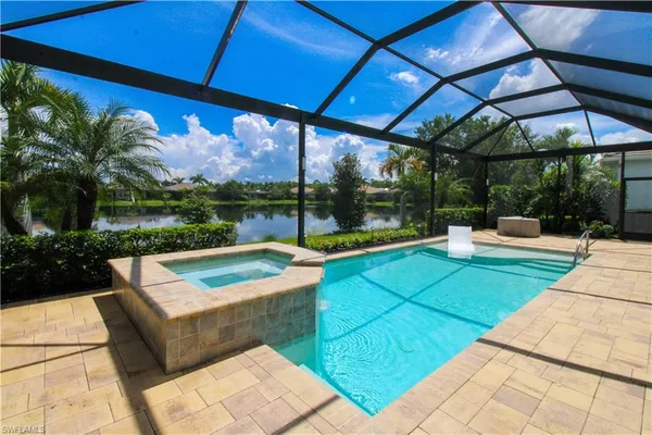 a view of a swimming pool with a patio