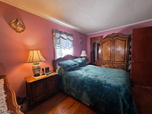 a bed room with a bed and a dresser