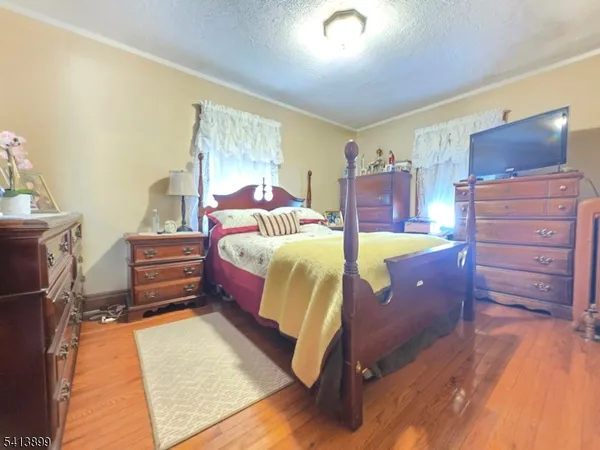 a bedroom with a bed and furniture