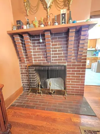 a view of a brick house with a patio