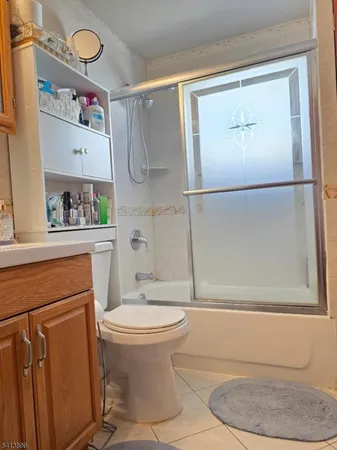 a bathroom with a toilet and a shower curtain