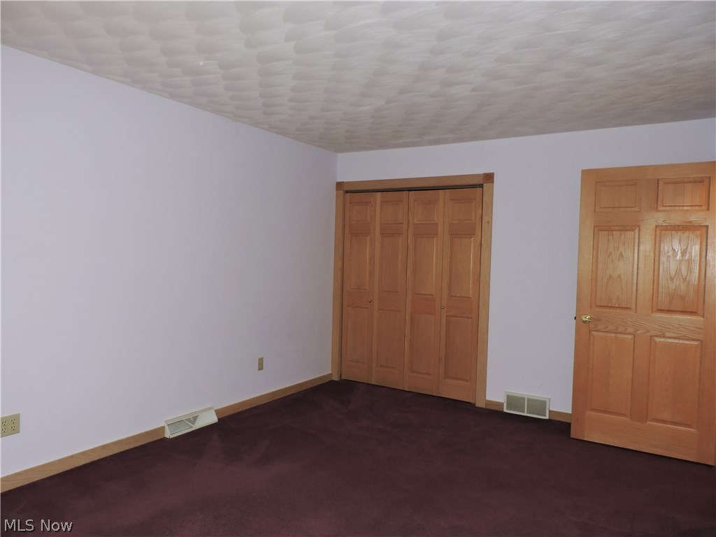 52755 Garfield Road Wakeman, OH 44889 - Photo 15 of 24 Guest room with dual door closet. Solid wood doors throughout.