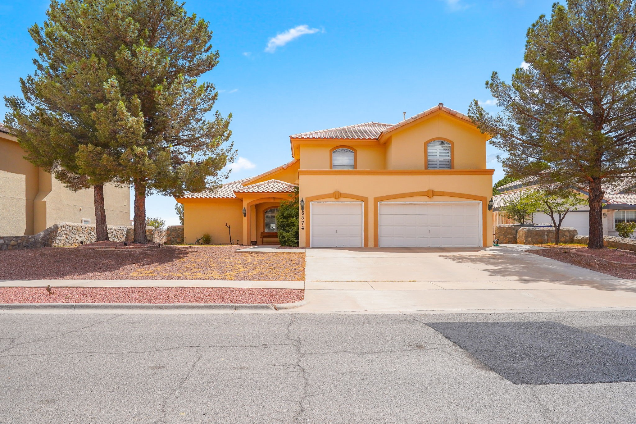 6574 Eagle Ridge Drive El Paso, TX 79912 - Photo 1 of 50 a front view of a house with a yard