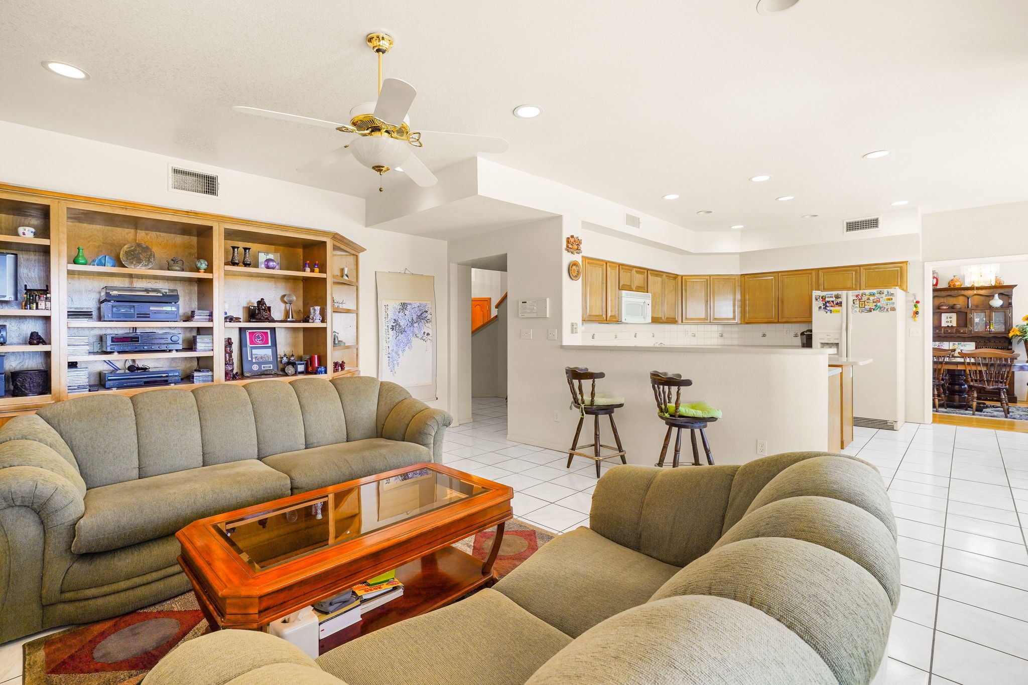 6574 Eagle Ridge Drive El Paso, TX 79912 - Photo 25 of 50 a living room with furniture kitchen view and a chandelier