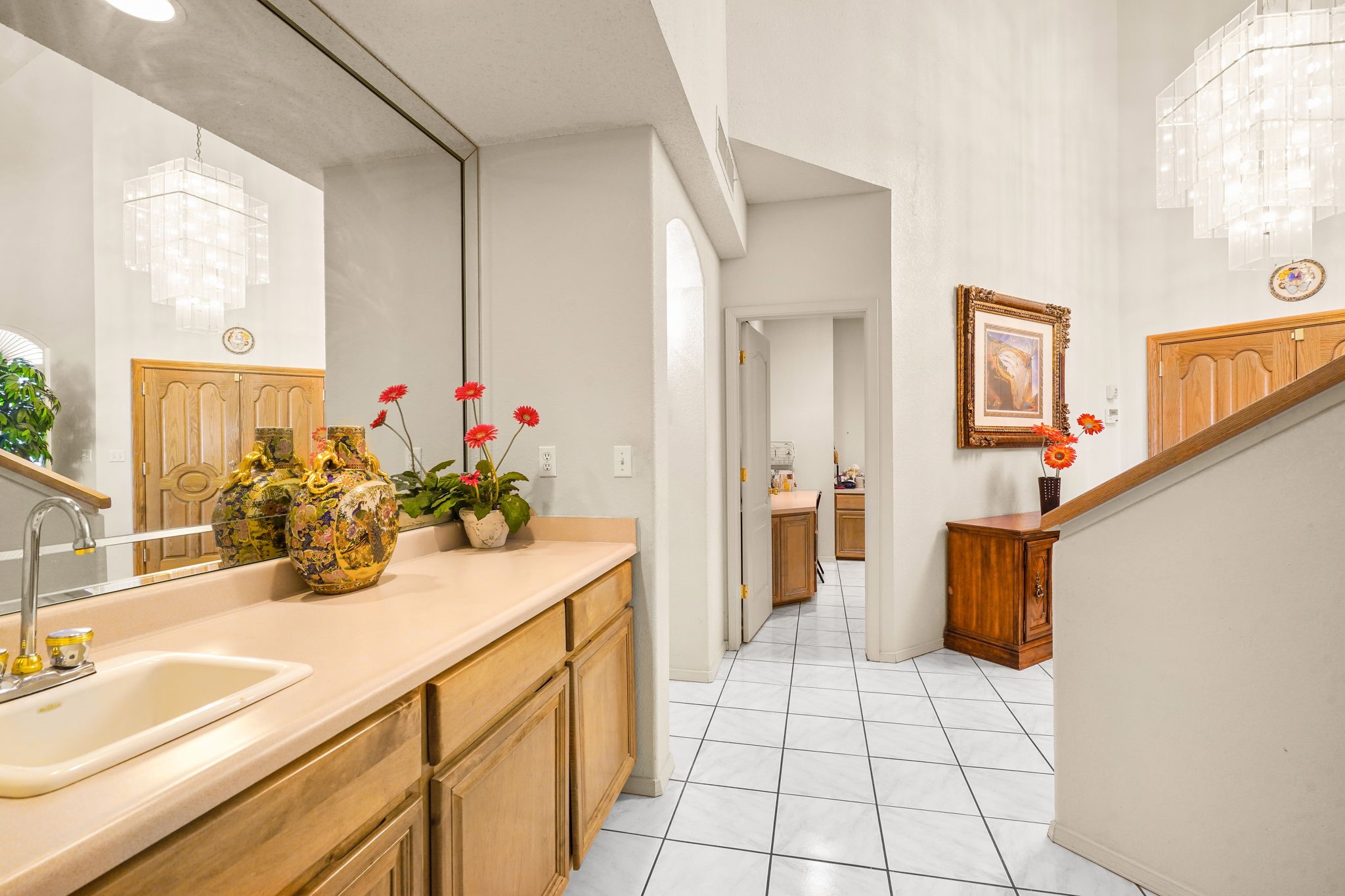 6574 Eagle Ridge Drive El Paso, TX 79912 - Photo 29 of 50 a bathroom with a sink a vanity and a mirror