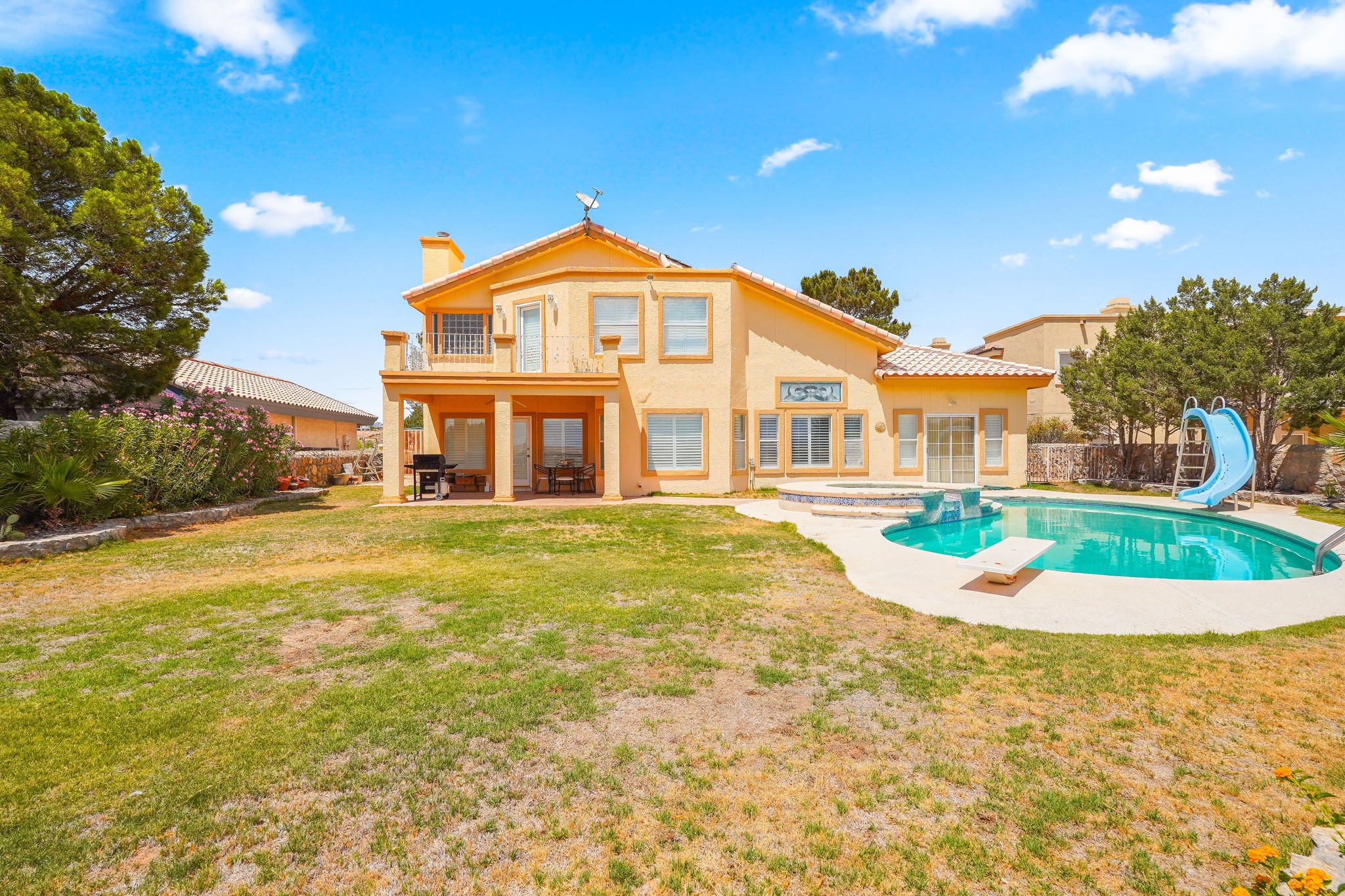 6574 Eagle Ridge Drive El Paso, TX 79912 - Photo 46 of 50 a front view of a house with a yard