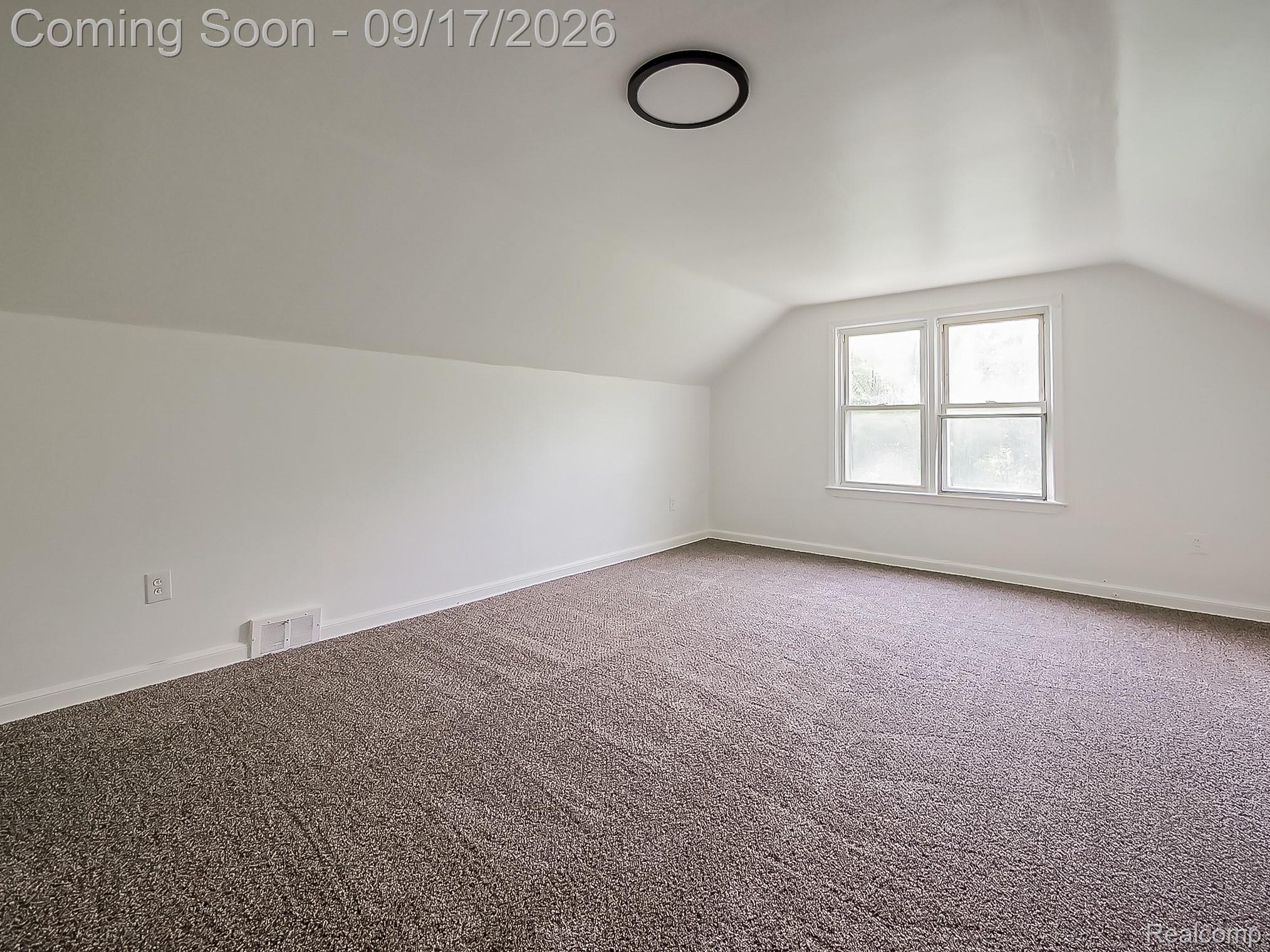14102 Toepfer Road Warren, MI 48089 - Photo 13 of 39 Sloped ceilings, neutral carpet, white walls, double window, and a flush mount ceiling light