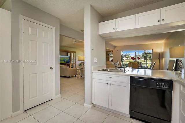 a kitchen with cabinets and appliances