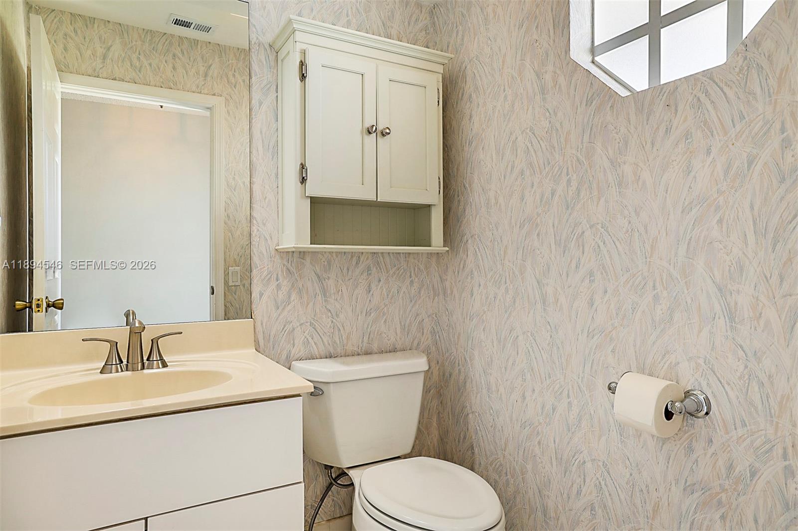 8853 Southeast Riverfront Terrace Jupiter, FL 33469 - Photo 15 of 38 1/2 Bathroom on main living areas.