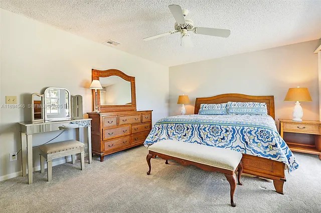 a bedroom with furniture and a baby crib
