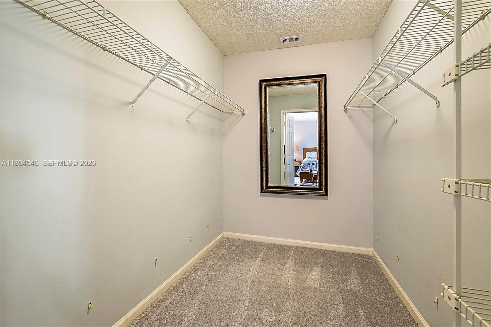 8853 Southeast Riverfront Terrace Jupiter, FL 33469 - Photo 21 of 38 Huge walk in closet in the master bedroom