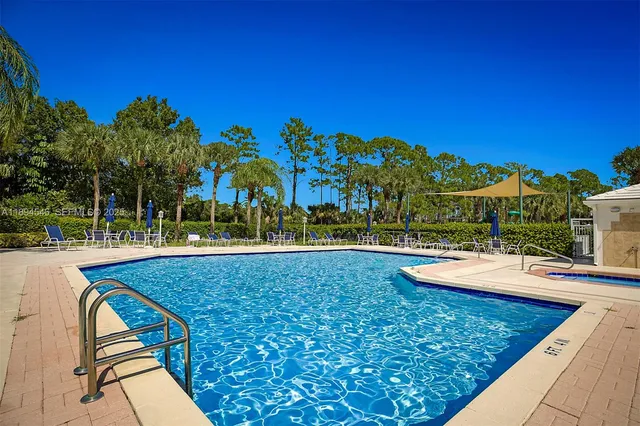 a view of swimming pool with a patio