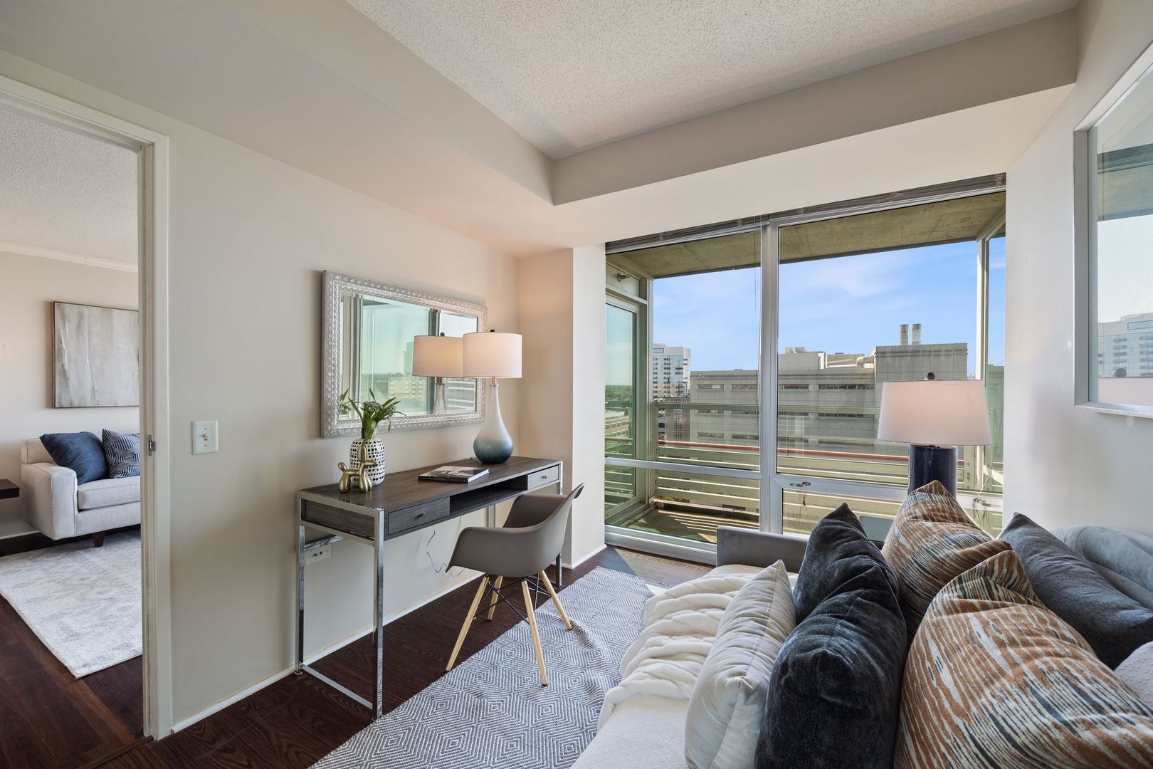 800 Elgin Road, Unit 1218 Evanston, IL 60201 - Photo 13 of 26 a living room with furniture and a large window