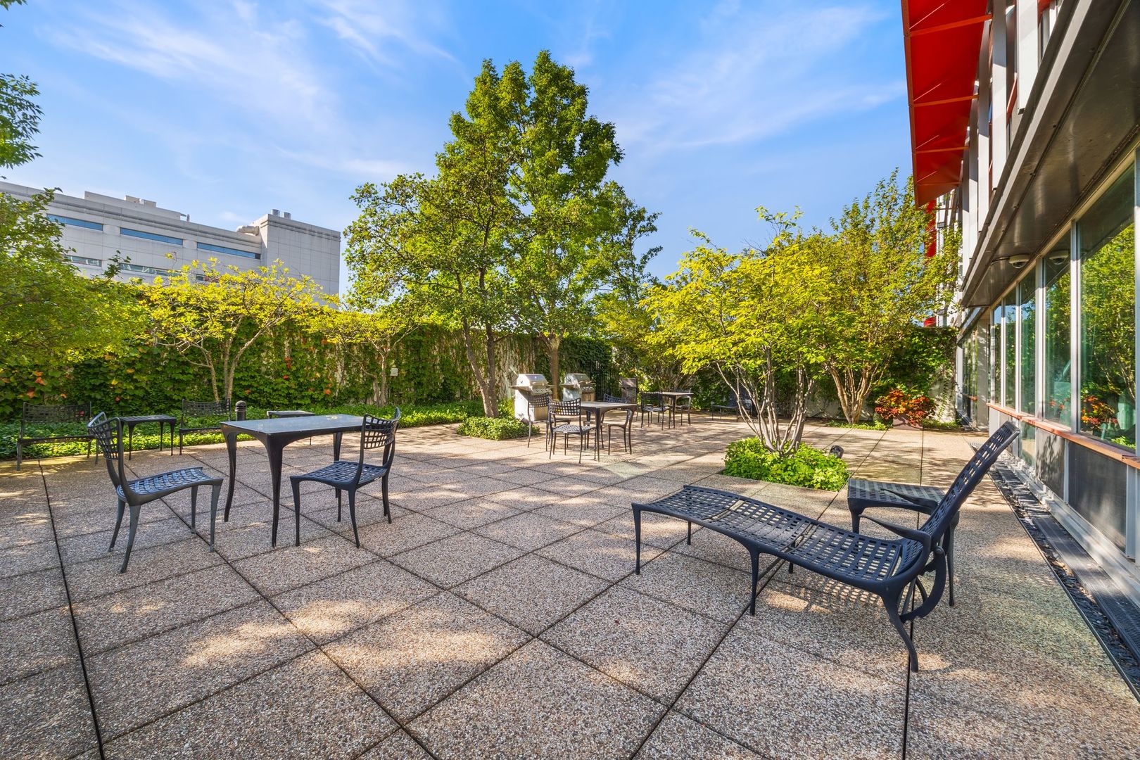800 Elgin Road, Unit 1218 Evanston, IL 60201 - Photo 17 of 26 a view of a patio with a table and chairs