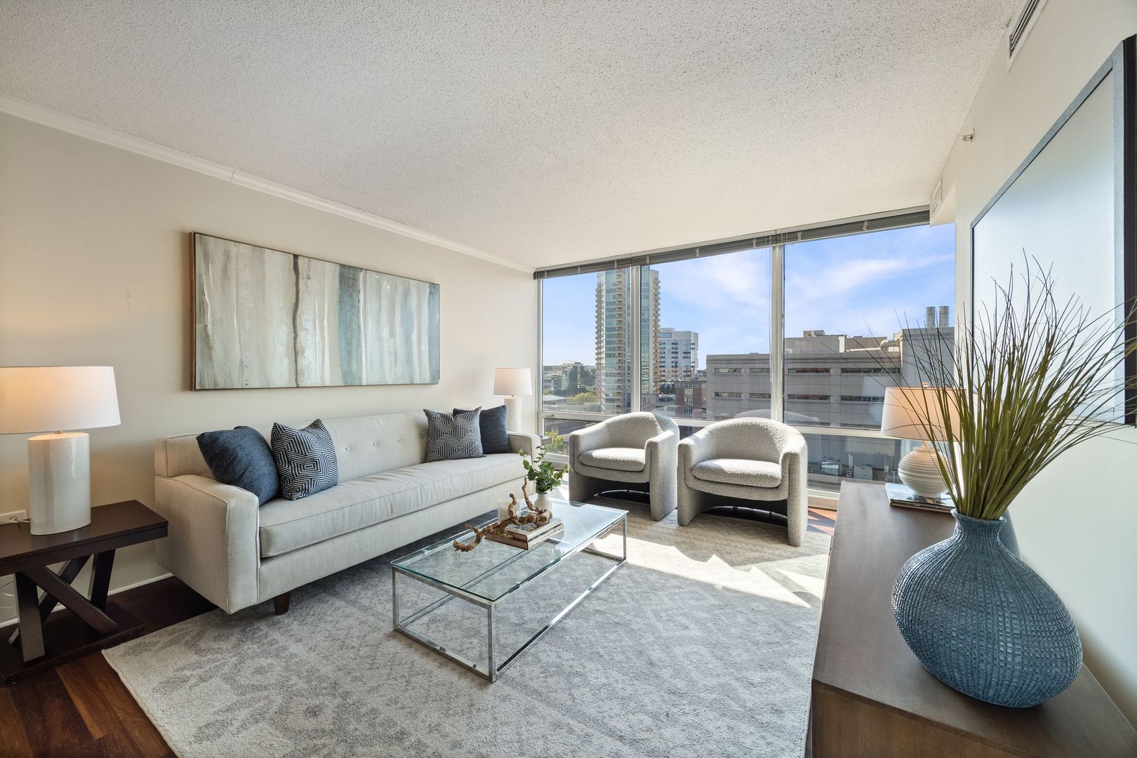 800 Elgin Road, Unit 1218 Evanston, IL 60201 - Photo 2 of 26 a living room with furniture and a large window