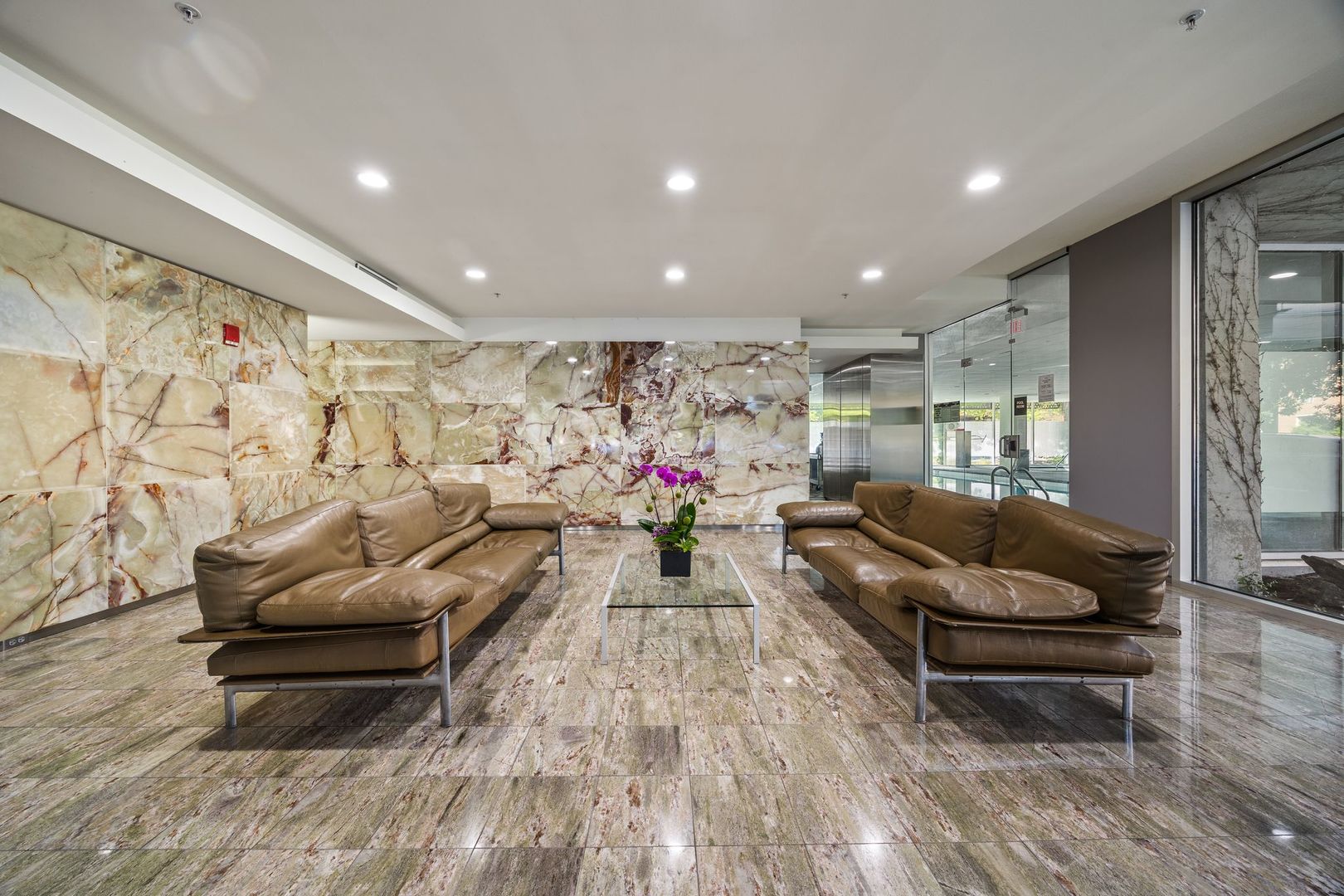 800 Elgin Road, Unit 1218 Evanston, IL 60201 - Photo 25 of 26 a living room with furniture and a potted plant