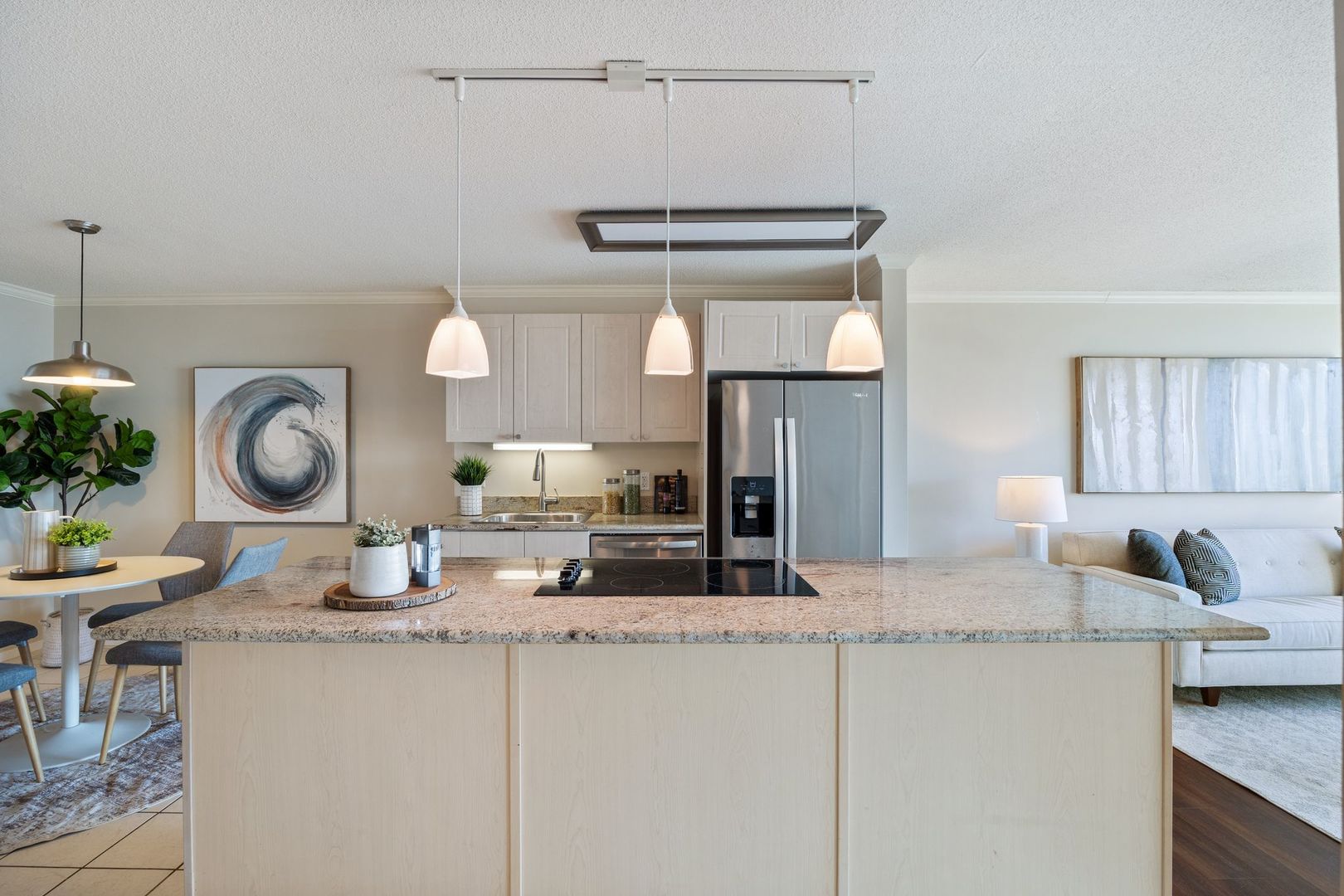 800 Elgin Road, Unit 1218 Evanston, IL 60201 - Photo 6 of 26 a kitchen with granite countertop a sink a stove and cabinets