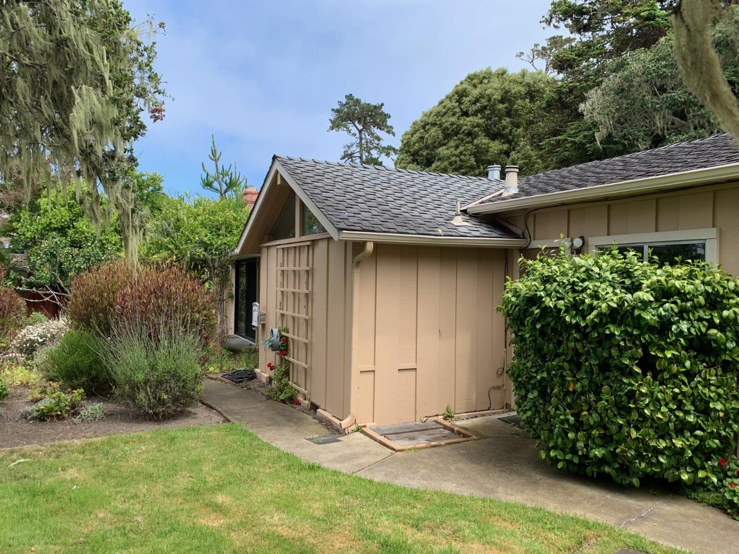 1012 San Carlos Road Pebble Beach, CA 93953 - Photo 15 of 20 a view of backyard of house with green space