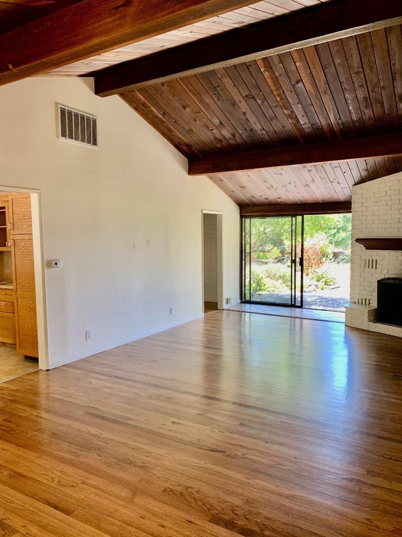 1012 San Carlos Road Pebble Beach, CA 93953 - Photo 4 of 20 a view of empty room with wooden floor and fan