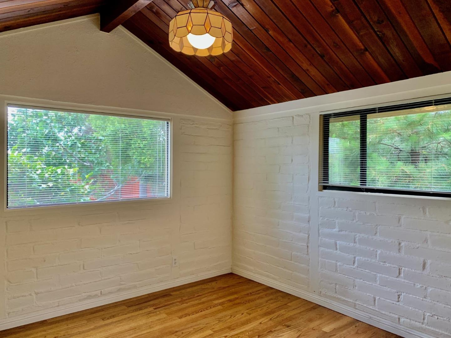 1012 San Carlos Road Pebble Beach, CA 93953 - Photo 8 of 20 a view of empty room with wooden floor and fan