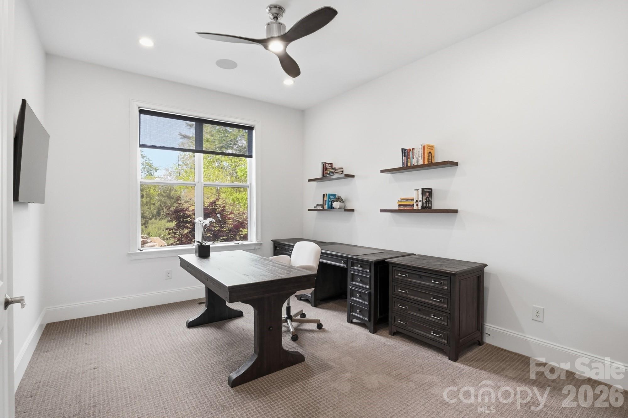 411 Turtleback Ridge Weddington, NC 28104 - Photo 21 of 48 a view of a workspace with furniture and a window