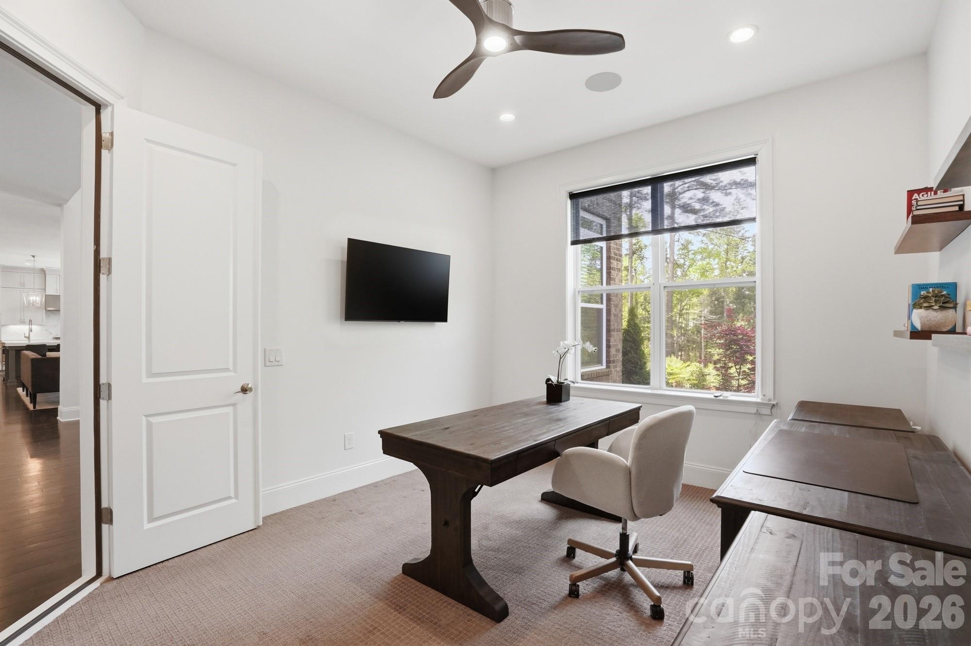 411 Turtleback Ridge Weddington, NC 28104 - Photo 22 of 48 a view of a livingroom with furniture and a flat screen tv