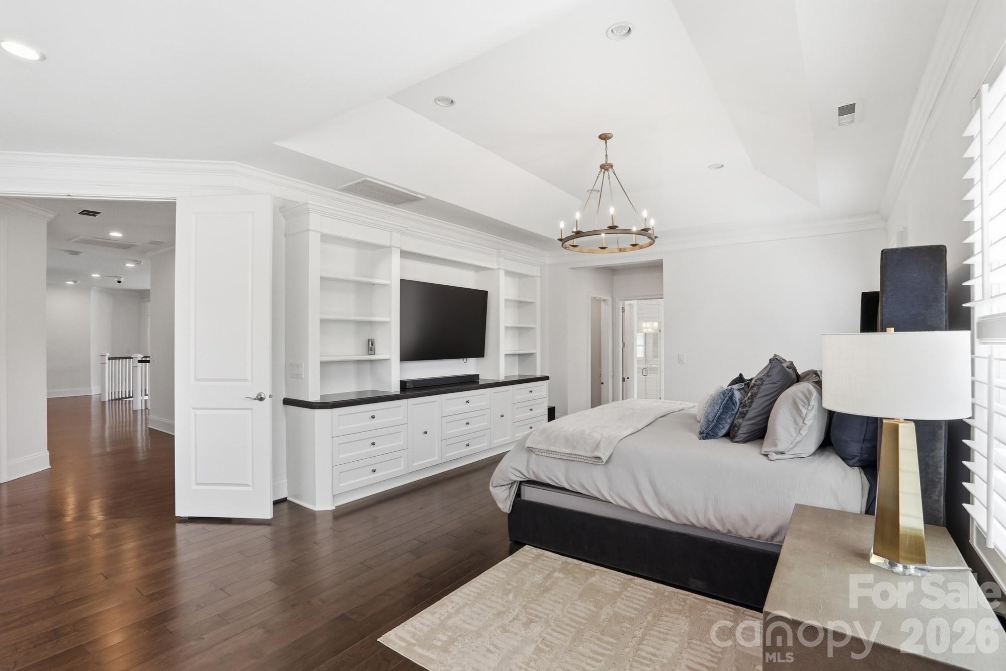 411 Turtleback Ridge Weddington, NC 28104 - Photo 24 of 48 a bedroom with furniture and a flat screen tv