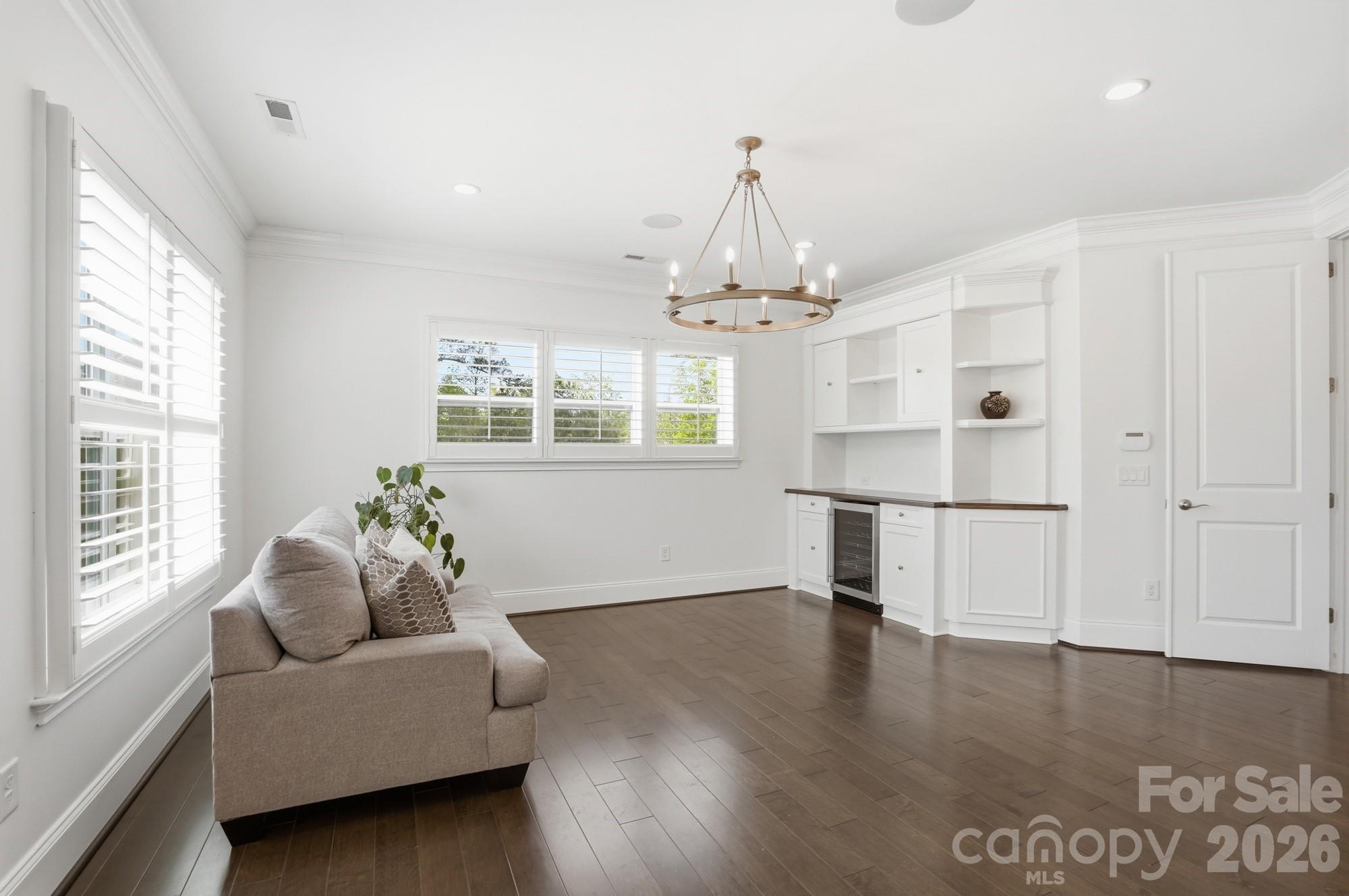 411 Turtleback Ridge Weddington, NC 28104 - Photo 25 of 48 a living room with furniture and a chandelier
