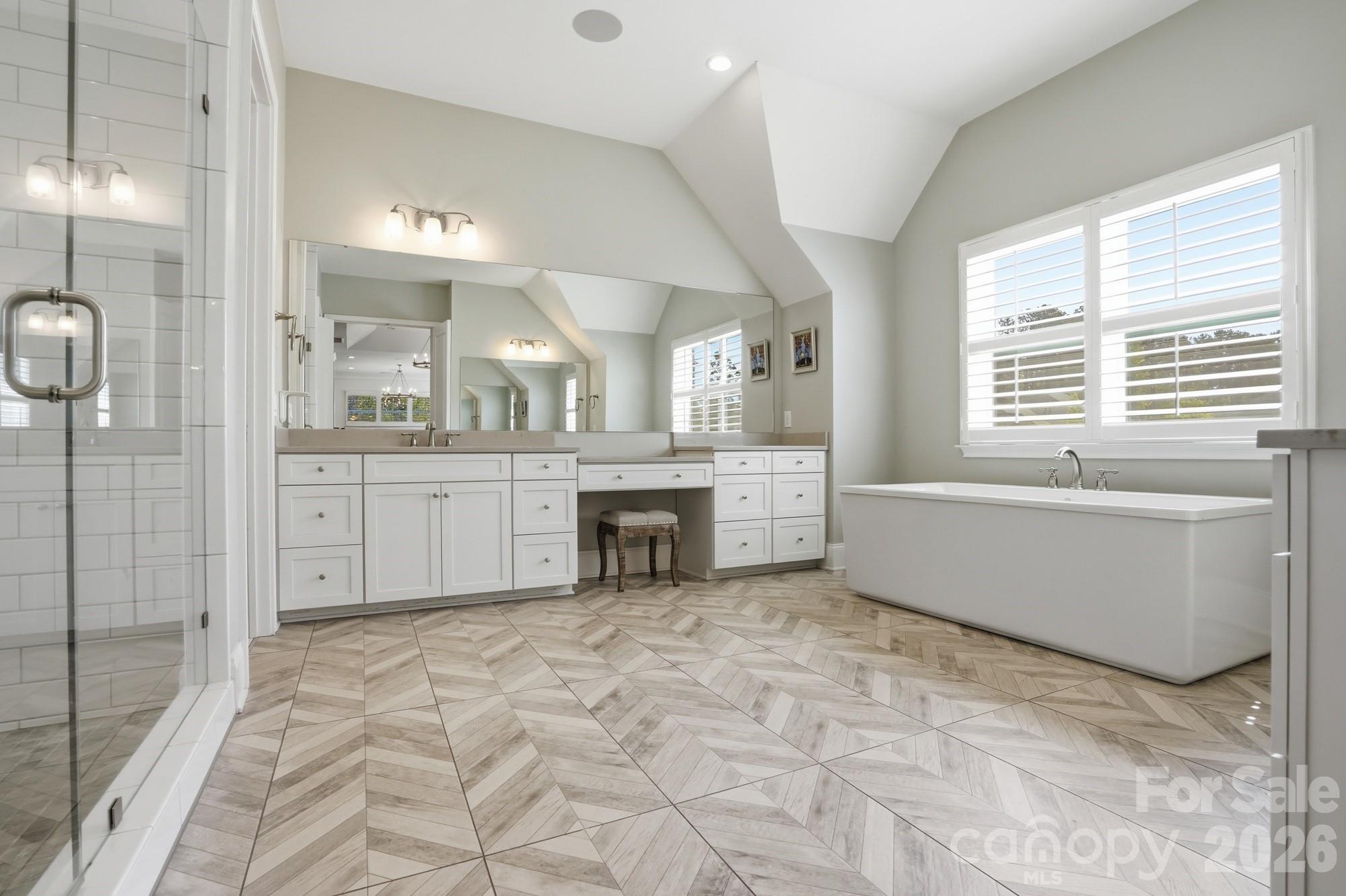 411 Turtleback Ridge Weddington, NC 28104 - Photo 26 of 48 a large bathroom with a large tub and sink
