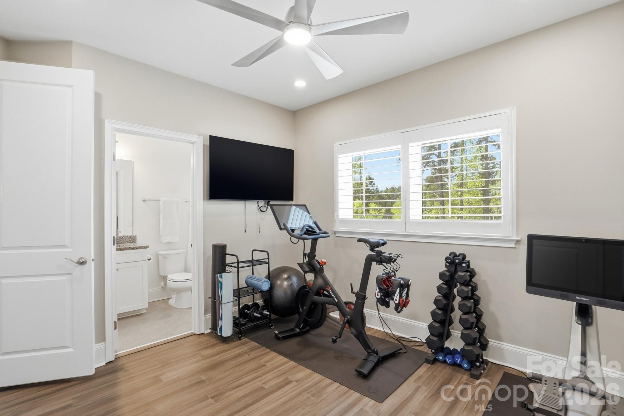 411 Turtleback Ridge Weddington, NC 28104 - Photo 30 of 48 a living room with furniture and a flat screen tv
