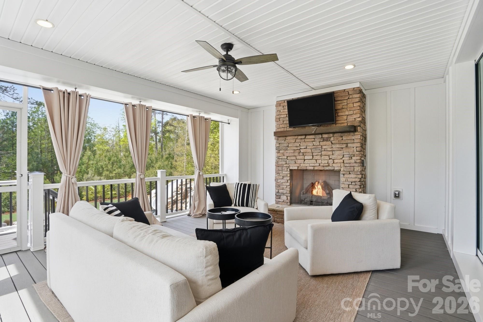 411 Turtleback Ridge Weddington, NC 28104 - Photo 35 of 48 a living room with furniture fireplace and a large window
