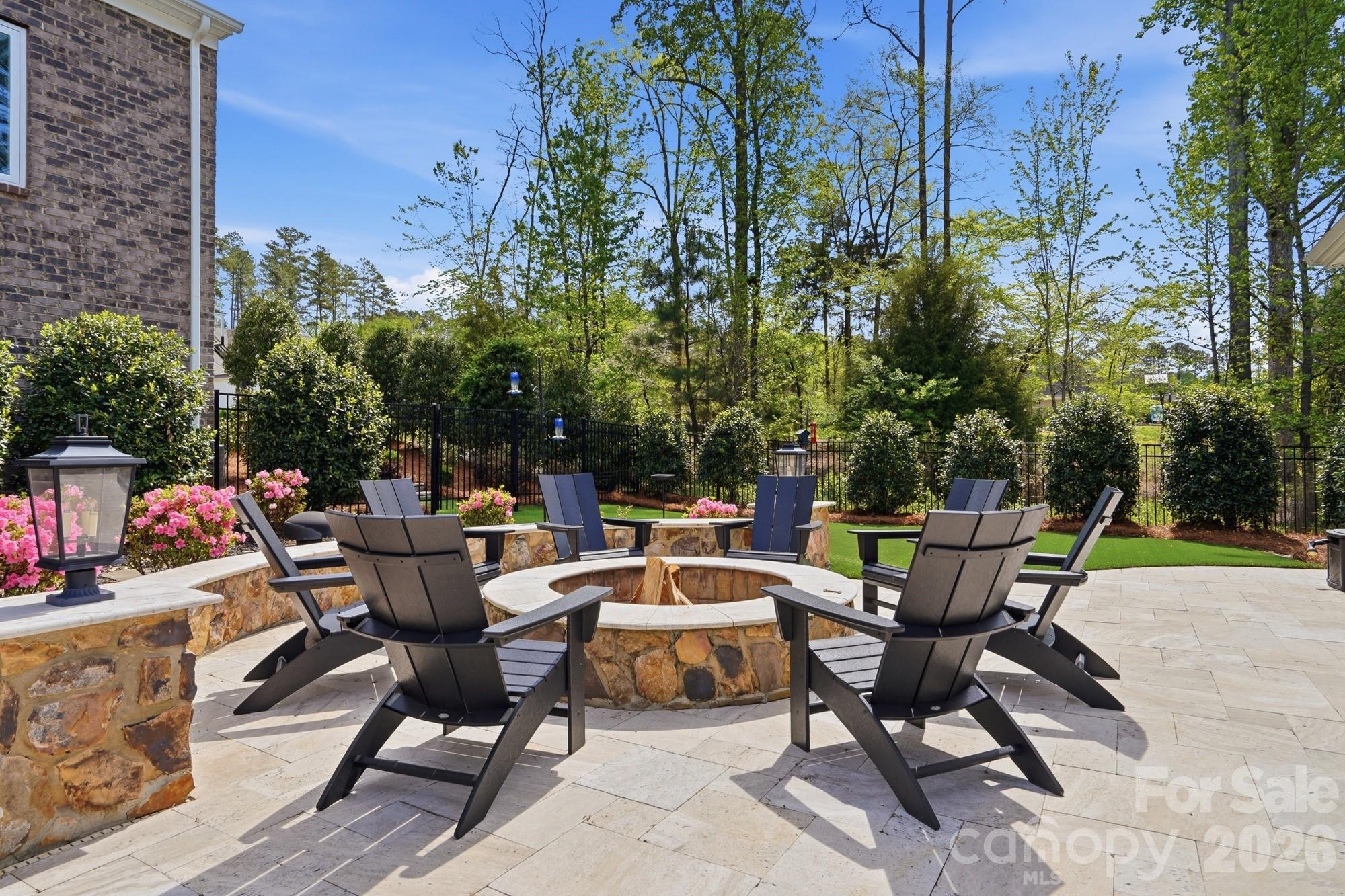 411 Turtleback Ridge Weddington, NC 28104 - Photo 42 of 48 a backyard of a house with table and chairs