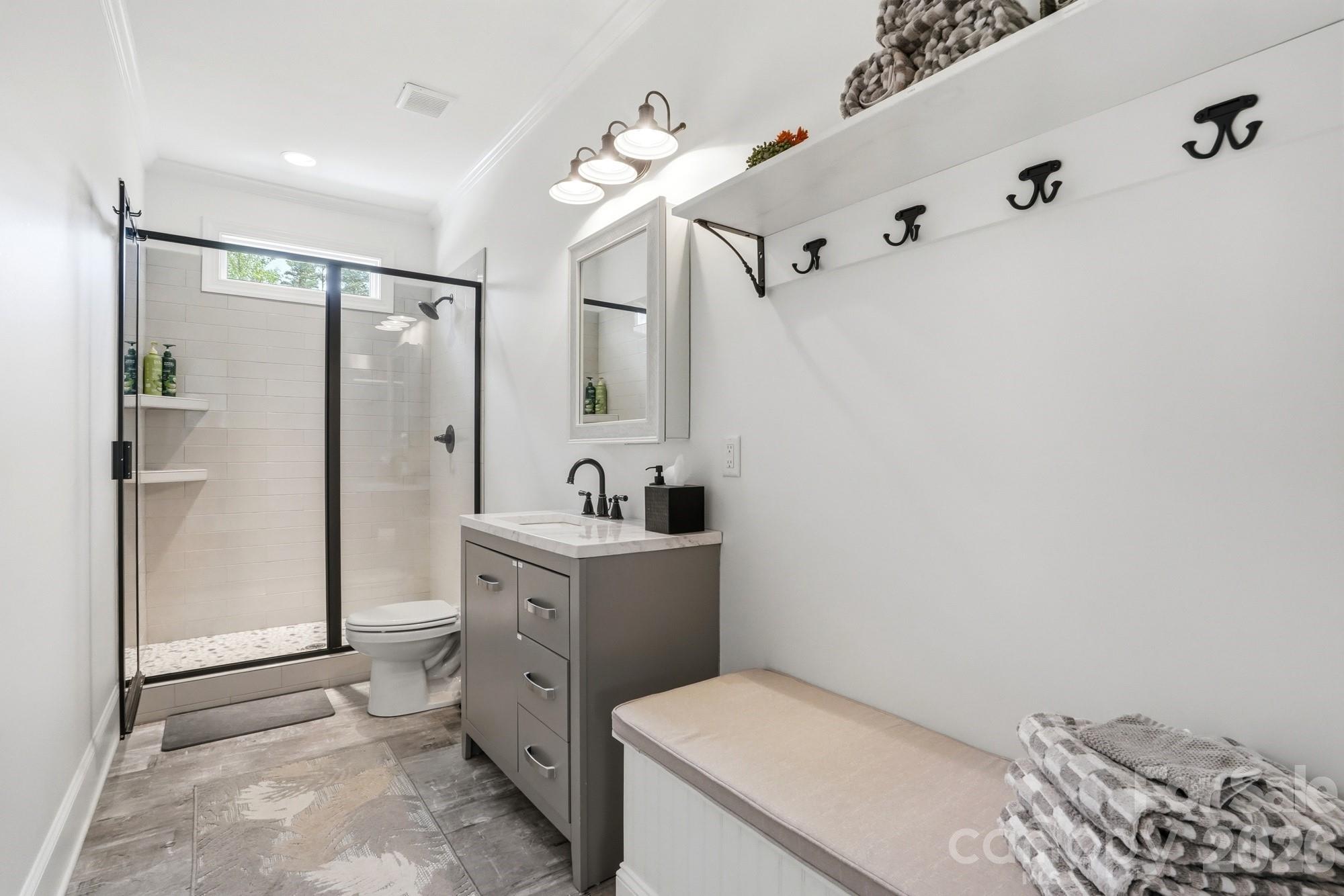 411 Turtleback Ridge Weddington, NC 28104 - Photo 45 of 48 a bathroom with a sink and a mirror
