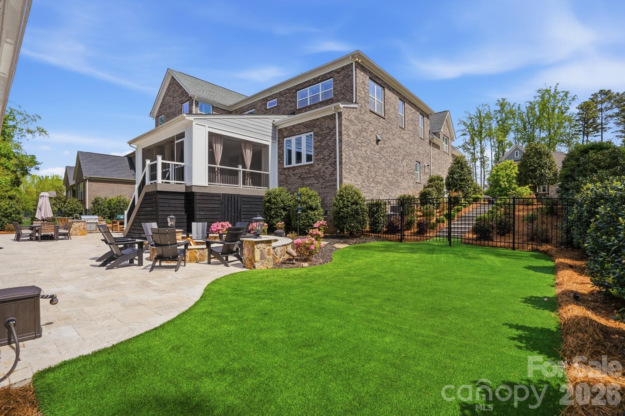 411 Turtleback Ridge Weddington, NC 28104 - Photo 46 of 48 a front view of a house with sitting area and garden