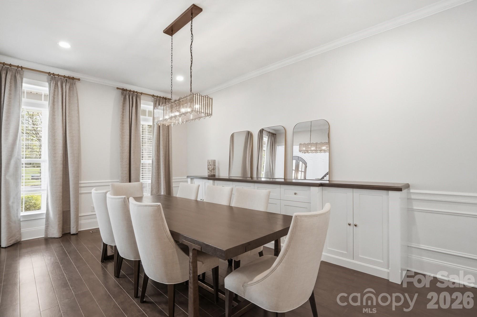 411 Turtleback Ridge Weddington, NC 28104 - Photo 6 of 48 a view of a dining room with furniture and wooden floor