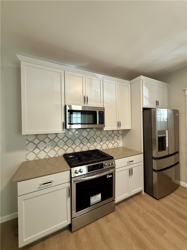 171 Cedarwood Terrace Rochester, NY 14609 - Photo 9 of 29 New stainless appliances, all stay with the home.