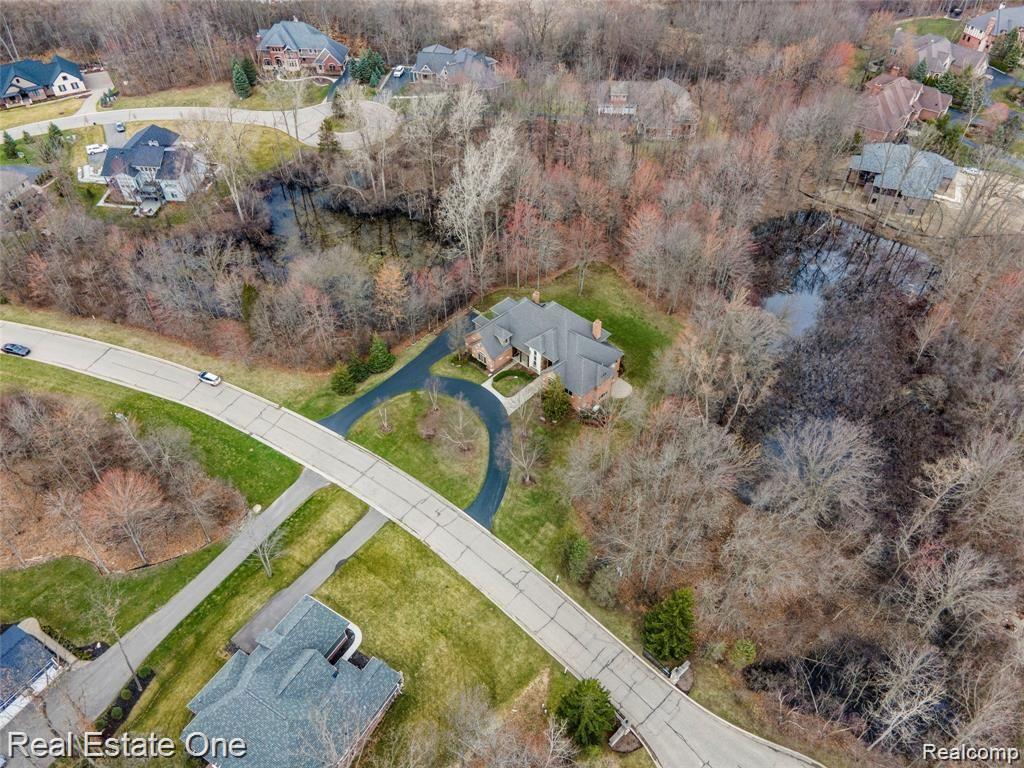 7500 Maple Ridge Drive Clarkston, MI 48346 - Photo 4 of 75 Just less than an acre (.87), subject has a circular driveway and side entry 3 car garage. Adjacent lots cannot be built on giving the feel of even more acreage. Beautiful lot!