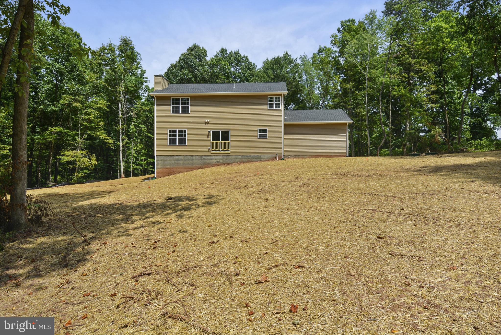 Rogues Road Midland, VA 22728 - Photo 19 of 24 a front view of a house with a yard and garage