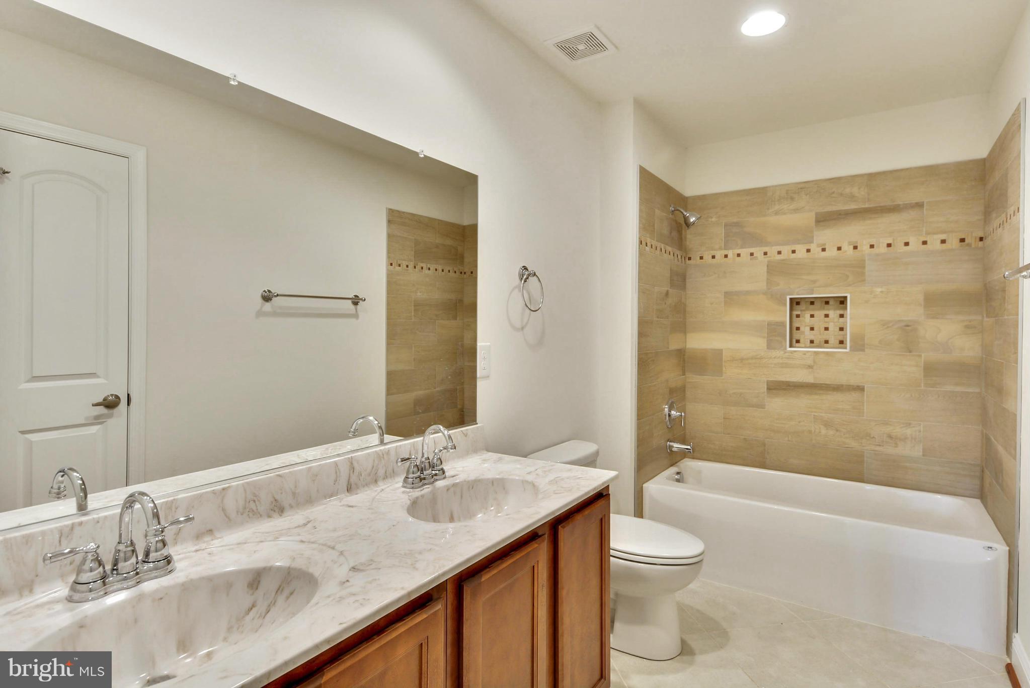Rogues Road Midland, VA 22728 - Photo 3 of 24 a bathroom with a granite countertop sink toilet and shower
