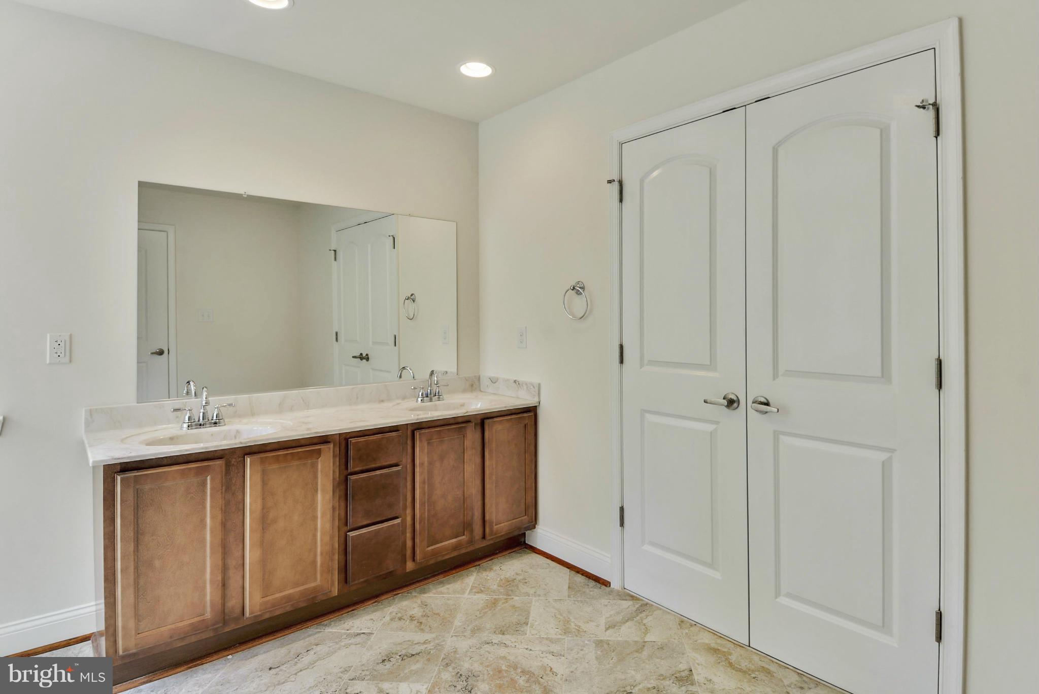 Rogues Road Midland, VA 22728 - Photo 4 of 24 a bathroom with a double vanity sink and mirror