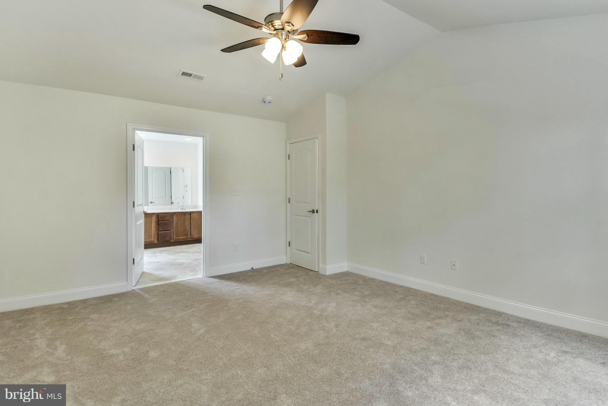 Rogues Road Midland, VA 22728 - Photo 5 of 24 an empty room with a empty space and a ceiling fan