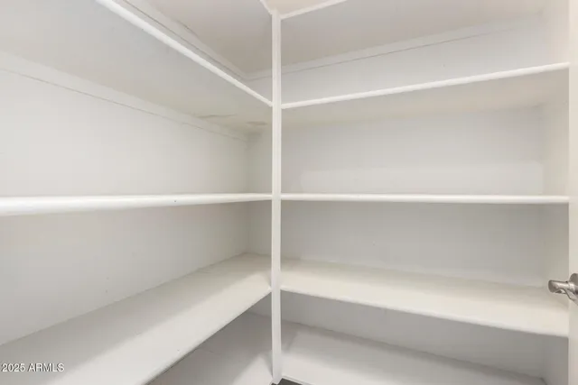 a view of an empty walk in closet
