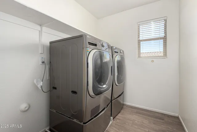a close view of a utility room with dryer and washer