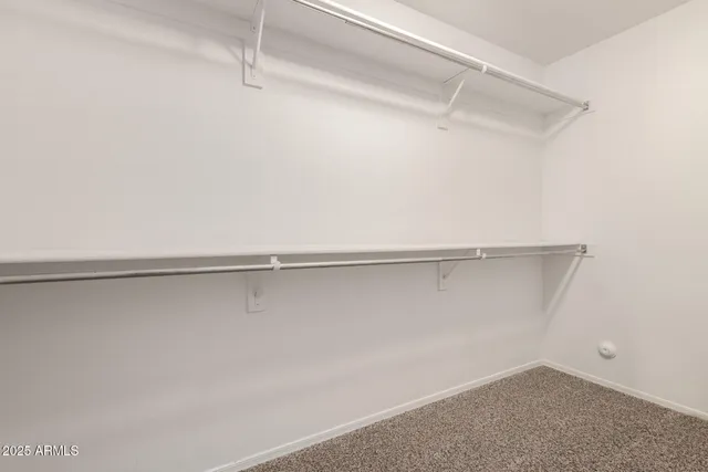 a view of a room with shelf on the wall