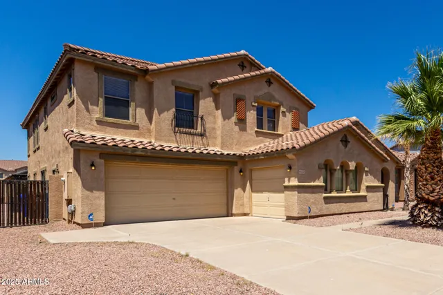 a front view of a house with a garage