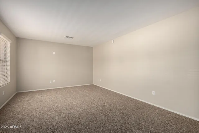 an empty room with a empty space and window