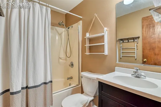 a spacious bedroom with a bed and window